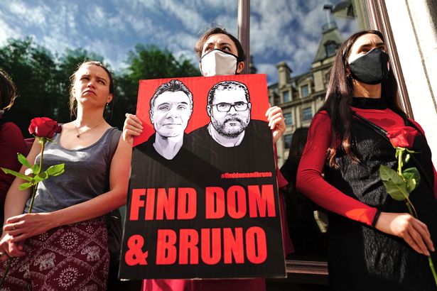 People take part in a vigil outside the Brazilian Embassy in London for Dom Phillips and Bruno Araujo Pereira, a British journalist and indigenous affairs official who are missing in the Amazon.
