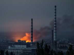 Smoke and flame rise after a military strike on a compound of Sievierodonetsk's Azot Chemical Plant, as Russia's attack on Ukraine continues, in Lysychansk, Luhansk region, Ukraine June 18, 2022.