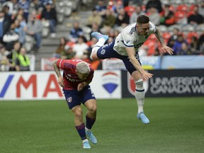 Whitecaps defender Jake Nerwinski (right), in action against FC Dallas last month at BC Place Stadium, says his club 'needs to be a full 10 guys that are compact, and fighting together and pressing together' on Saturday in the Texas heat.